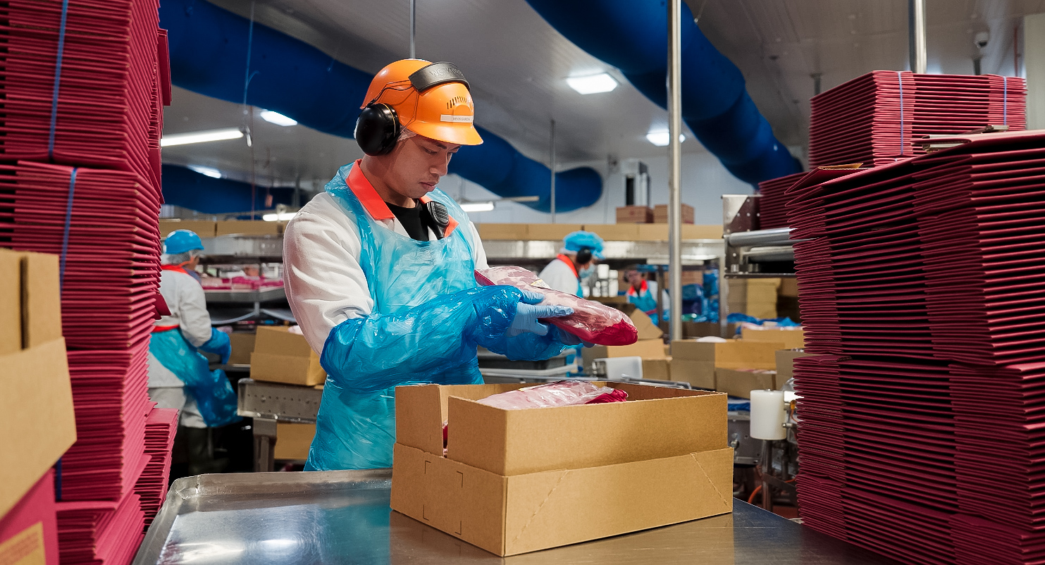 Quality control on the packing line at Big River Pork